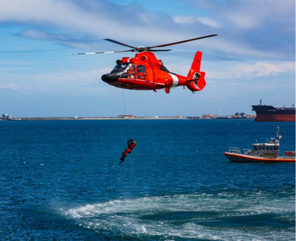 Helicopter hovering over ocean in a sea rescue, performing Duty of Care